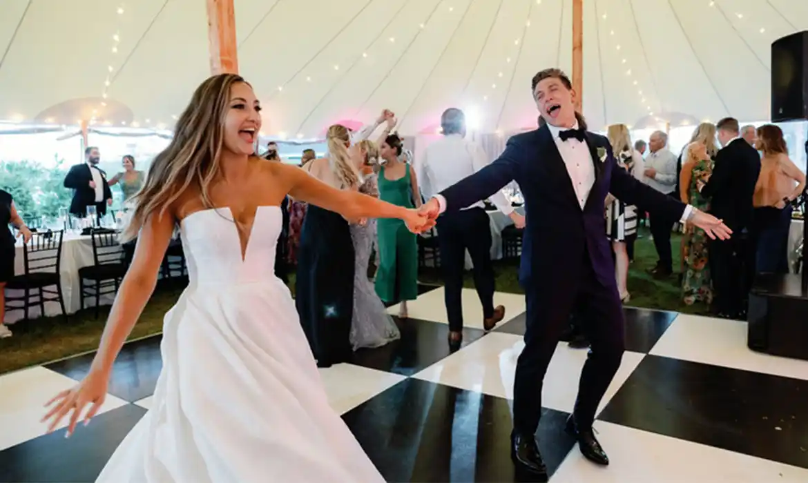 Bride & Groom dancing on Black & White Checkered Dance Floor