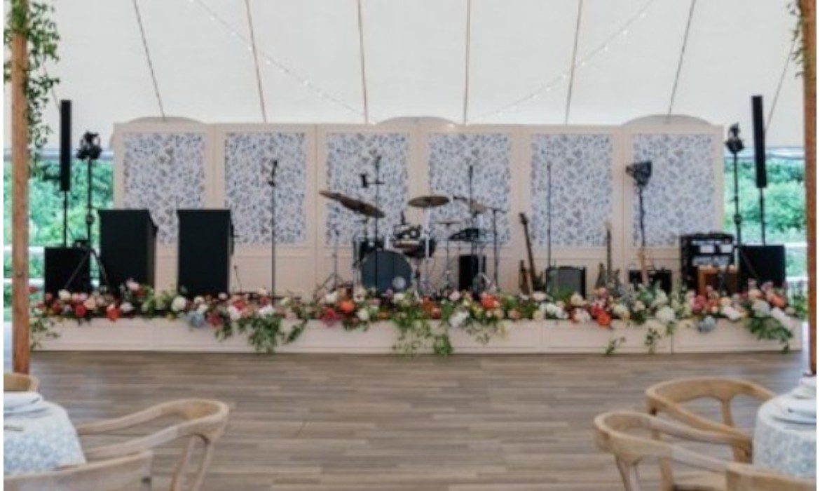band set-up with stage backdrops behind
